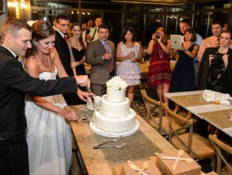 Cutting the wedding cake in the Solarium Love More photo